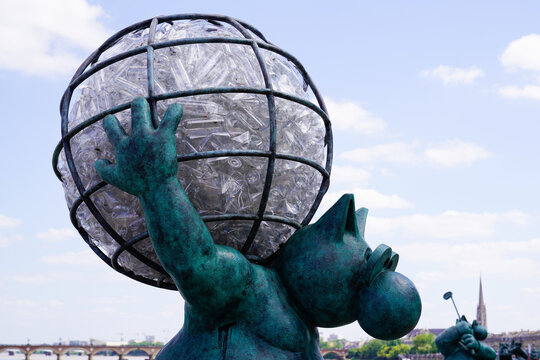 Exhibition Le chat deambule The cat walks with globe earth in back had it up in Bordeaux by Philippe Geluck statues cartoonist