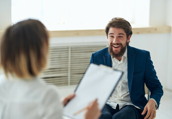 man communicates with woman job interview office emotions