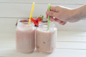 strawberry cherry smoothie in a glass