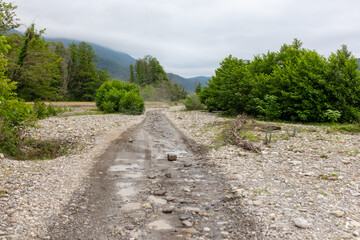 Fototapeta na wymiar Dirt road in a mountainous area