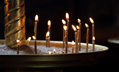 Candles are burning in an Orthodox church.