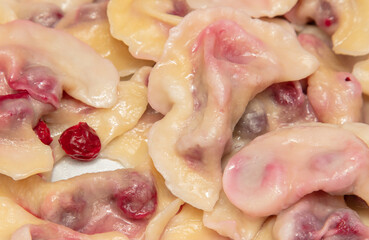 Close-up of dumplings with cherries.