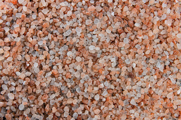 The surface is covered with large crystals of pink Himalayan salt.