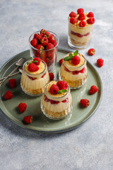 Homemade raspberry trifles on a light background.