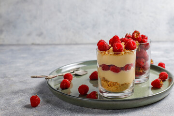 Homemade raspberry trifles on a light background.