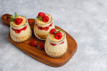 Homemade raspberry trifles on a light background.