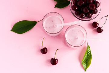 morning cherry smoothie. delicious diet healthy breakfast. pink background. top view.