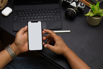 Close up male hands, using smartphone, phone blank screen mockup