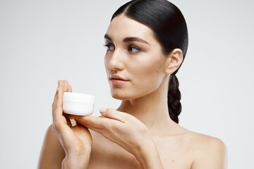 Brunette Bare Shoulders Cream Jar Dermatology