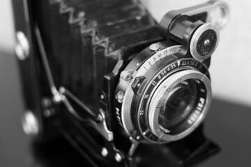 The lens of an old film rangefinder camera