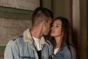 Portrait of young couple in love looking at each other. Young couple on evening romantic date....