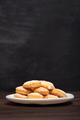 Homemade baking. Shortbread. Appetizing sand cookies. Baking for tea. Copy space. Vertical frame