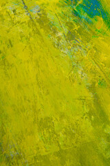 colorful creative motley background: smudged residues of oil paints on a wooden palette, short focus, selective blur