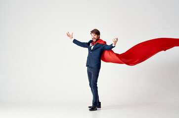 business man in suit red cloak superhero manager light background