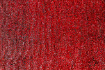 abstract creative background: red stain of colored primer when toning the canvas, temporary object.