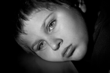 Emotional Argentinian male looking at nowhere in grayscale