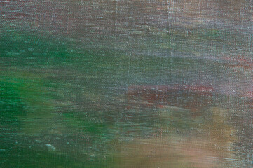 abstract colored creative background - rough linen canvas unevenly covered with multi-colored...