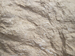 Textured stone wall. Natural stone background. Rock texture backgrounds close up.