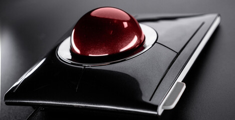Trackball Computer Mouse on a black background. Control Device with Scroll Wheel