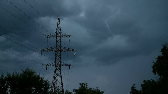 Lightning and Thunderstorm flash over the High voltage power lines Skyline