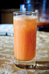 freshly squeezed orange juice in a glass glass close-up 