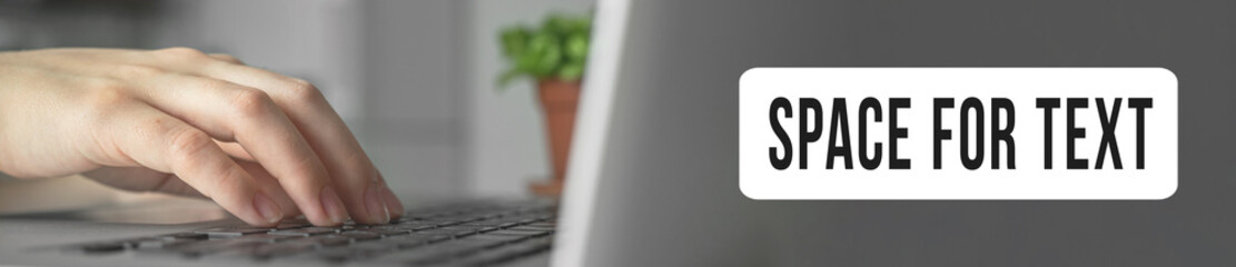 Woman hands typing on laptop keyboard close-up. Wide web banner with space for your text. Working from home. Online learning or internet marketing, freelance workspace concept background photo