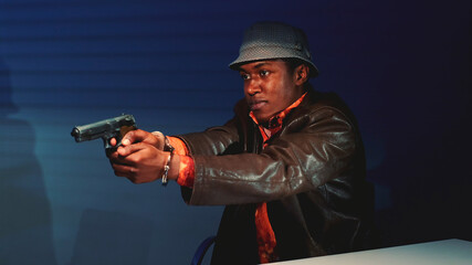 Close-up of black criminal grabbing the gun and threatening to harm cops. He trying to escape from interrogation room.