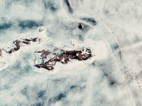 Lighthouse Island In A Frozen Lake Aerial