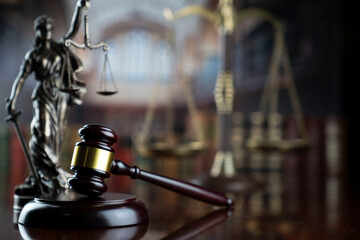 Law and justice concept. Law symbols composition: judge’s gavel, Themis  statue and scale.