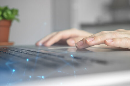 Female hands on laptop computer. Woman working remotely at home. Concept of networking and remote freelance work, global business network photo