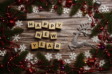 Happy New Year alphabet letter on wooden cubes with Christmas decoration