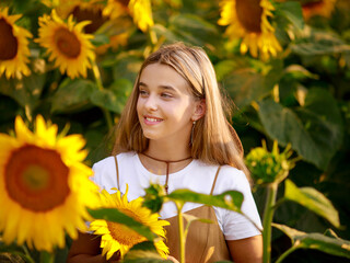 12 year old girl on a field of sunflowers