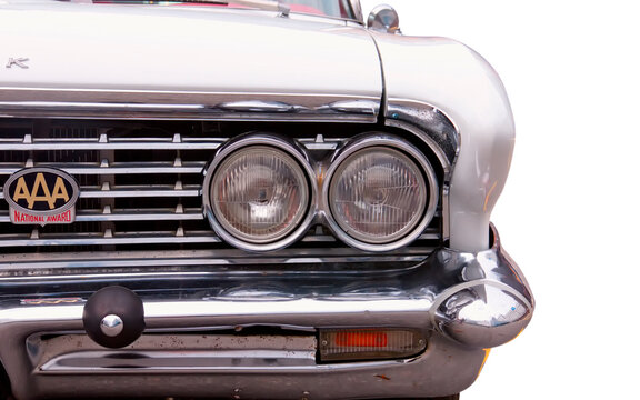 Classical American Rare Buick LeSabre 1961. White background. Detail of front light.