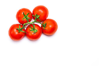 Overhead photograph of a bunch of five red natural tomatoes on a white background.The photo is taken in horizontal format and has copy space.