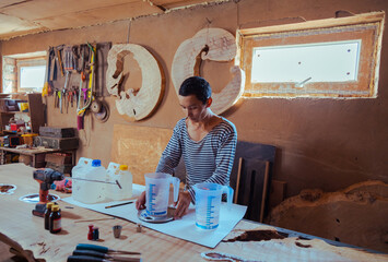 Carpenter preparing tools for woodworking and carpentry production