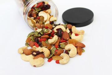 The healthy snack with ailmonds, nuts, dried grapes, pumkin seed and more of dried fruits. Focus in the middle and blurred around