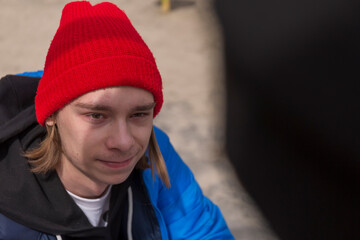 Teenagers guy and a girl on a walk in the city in the spring time in bright clothes