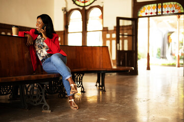 Beautiful woman using the phone. Young businesswoman talking to the phone.