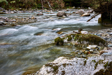 landscape of a water stream in rocky mountains