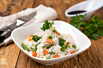 Bowl with tasty rice and vegetables