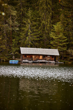 wilderness wooden house by a lake in the mountains