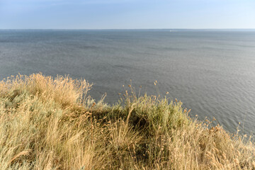Picturesque slope of the sea coast on a warm summer day
