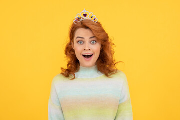 amazed redhead woman in queen crown, surprise