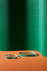 Abstract background for branding and minimal presentation. Glass podium on green folding paper...