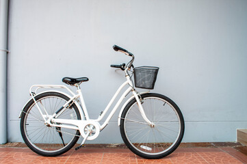 Fototapeta na wymiar white bicycle on white wall background