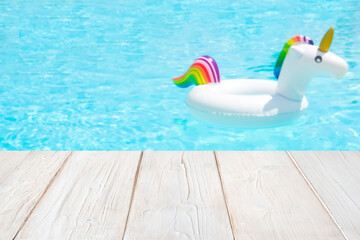 Blurred background inflatable unicorn ring in pool for product display