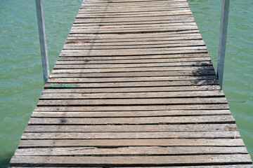 Fototapeta premium old wood bridge floor with water background 