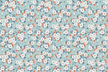 Cute floral pattern in the small flower. Seamless vector texture. Elegant template for fashion prints. Printing with small orange and white flowers. Blue background. Stock vector for prints.
