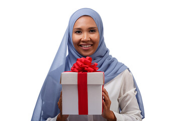 Close up portrait of happy young asian muslim woman in blue hijab holding gift box with ribbon isolated over white background