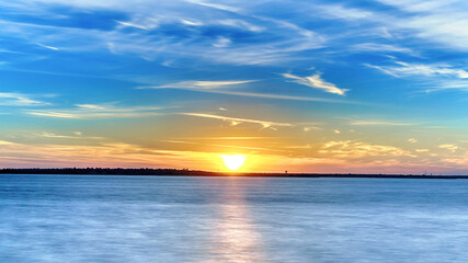 Fototapeta na wymiar sunset and blue gold sky